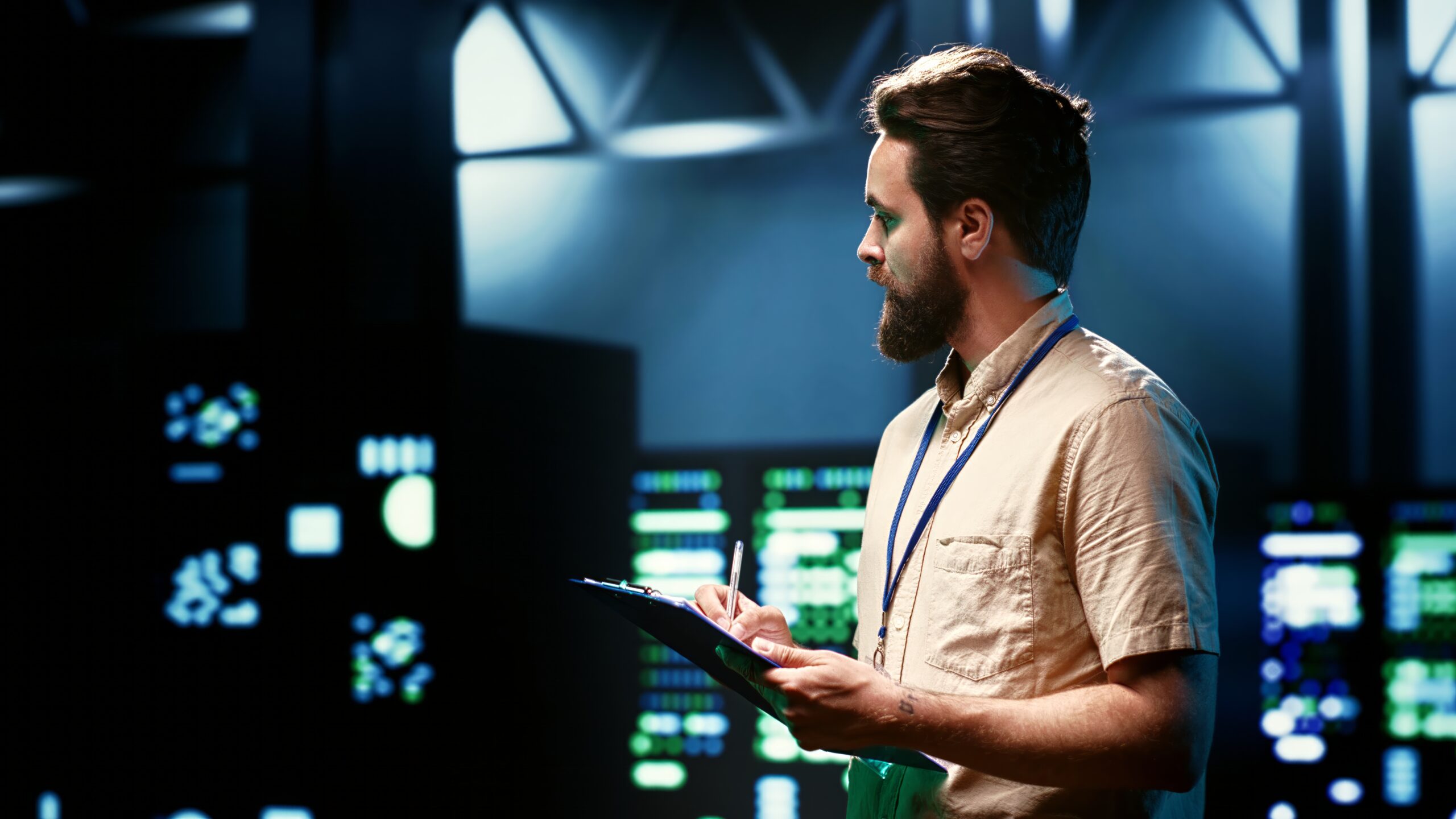 Cloud engineer reviewing infrastructure in a data centre