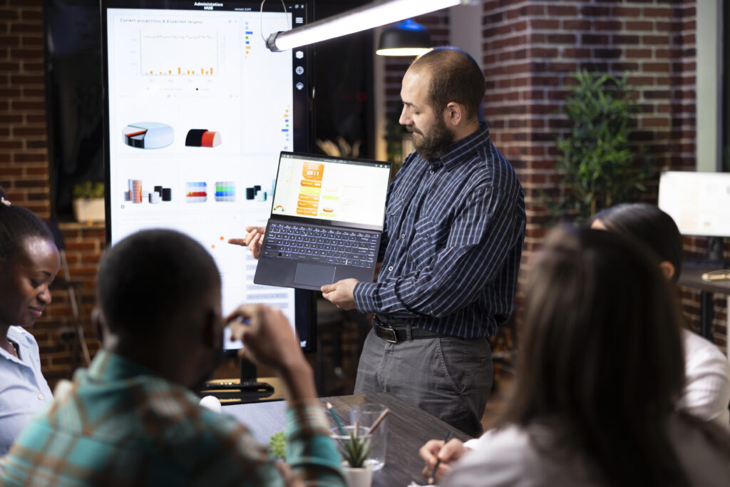 IT consultant presenting business and technology analytics to clients