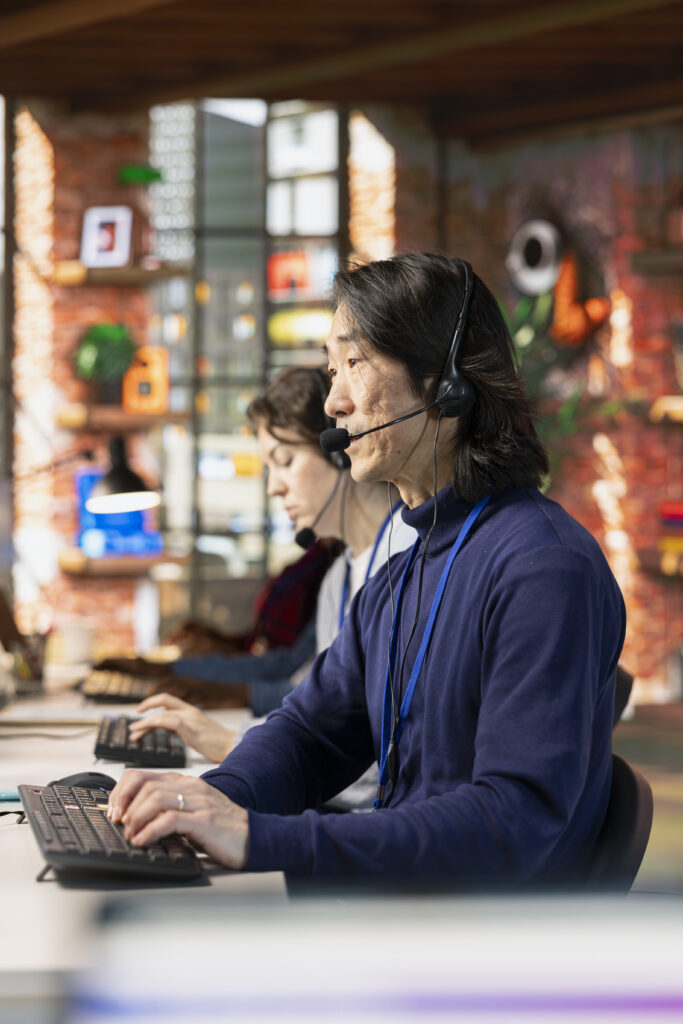 IT support agent helping a business customer over the phone