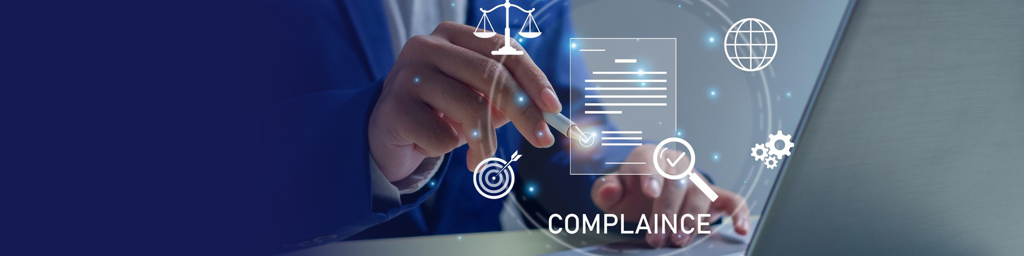 Business professional using a laptop with digital compliance icons