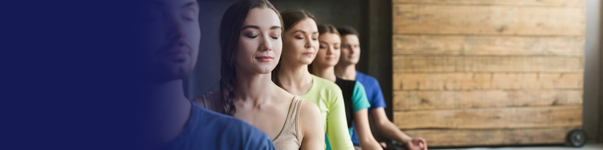 Group of people meditating in a wellness studio
