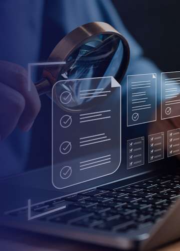 Magnifying glass over a digital checklist on a laptop